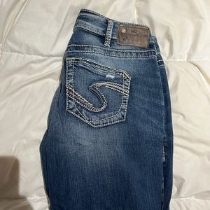 Silver mid-rise jeans.